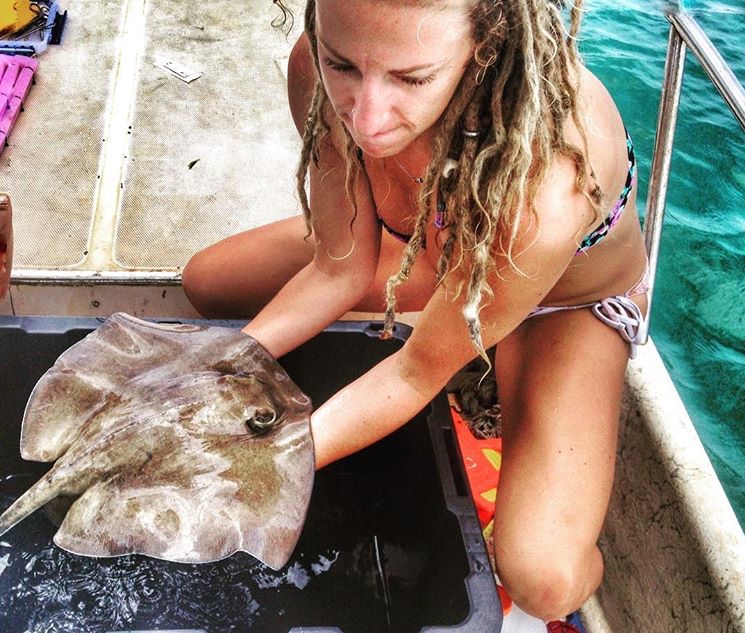 Michele Donihe holds marine animal 